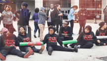 Black Youth Project 100 leader Charlene Carruthers (center, seated) reminds her comrades that they are there because the Chicago mayor wants to allocate an additional $200 million to Chicago police department.